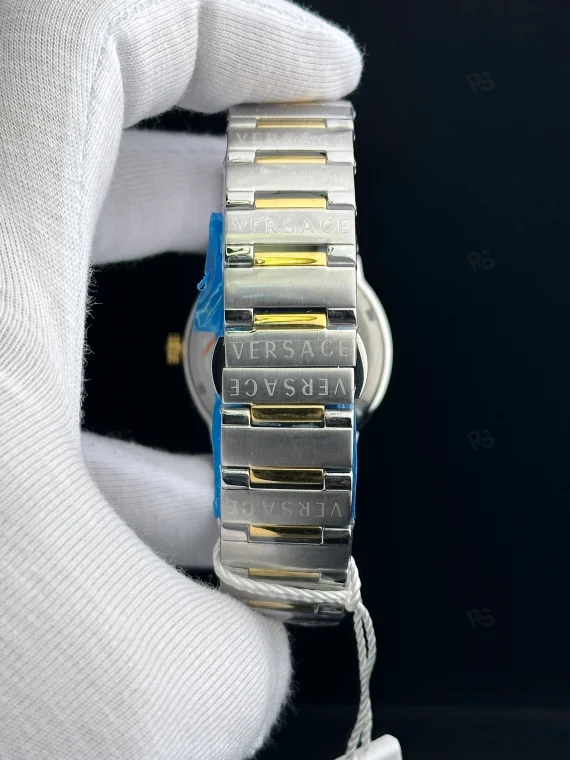 Versace Icon Greca tarzı kadın saat, mavi kadranlı, gold bezel ve çelik bilezikli pilli model