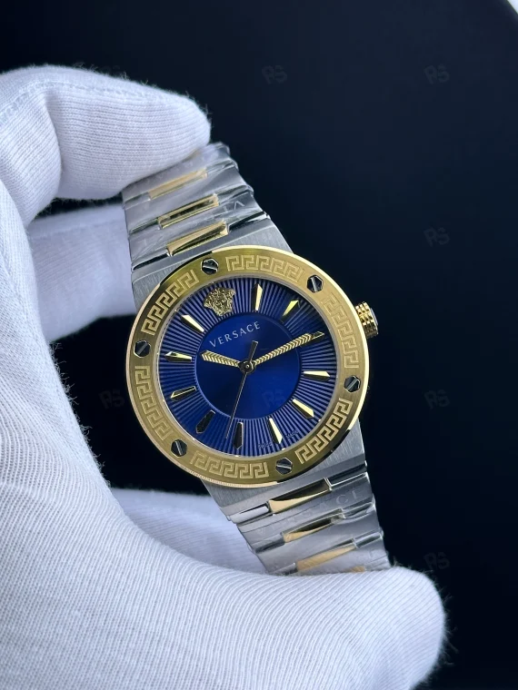 Versace Icon Greca tarzı kadın saat, mavi kadranlı, gold bezel ve çelik bilezikli pilli model