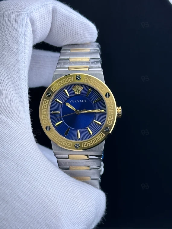 Versace Icon Greca tarzı kadın saat, mavi kadranlı, gold bezel ve çelik bilezikli pilli model