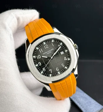 Patek Philippe Aquanaut, siyah grid desenli kadranlı, turuncu kauçuk kayışlı, çelik kasalı, otomatik mekanizmalı, ince kasalı lüks yazlık saat