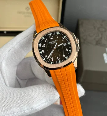 Patek Philippe Aquanaut, turuncu kauçuk kordonlu, rose gold kasalı, siyah kadranlı, otomatik mekanizmalı, ince kasalı lüks erkek saati