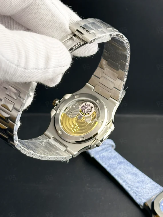 Patek Philippe Nautilus 5711 ince kasa, taşlı bezel, çelik bilezikli otomatik erkek saat