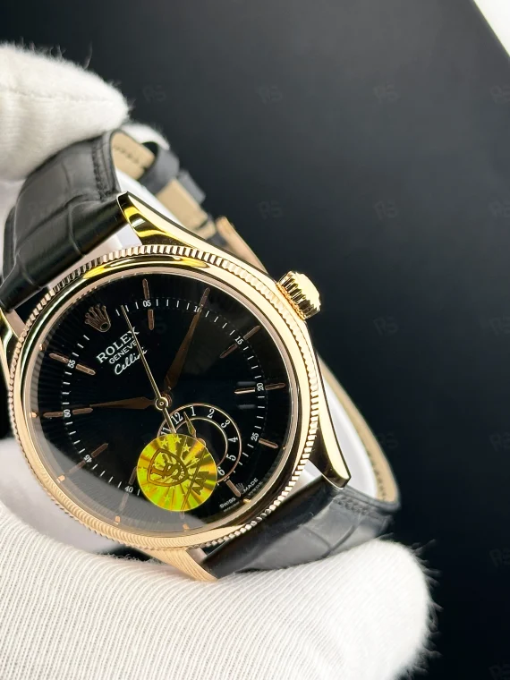 Rolex Cellini siyah kadranlı, rose gold kasa, otomatik mekanizmalı deri kayışlı erkek saat